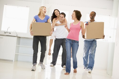 Removal team handling boxes during a Millwall home move