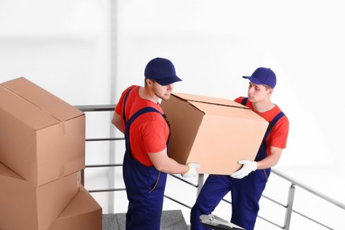 Office removals planning in Millwall with packed boxes and moving equipment