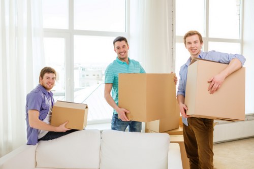 Professional movers handling a compact flat relocation in Millwall