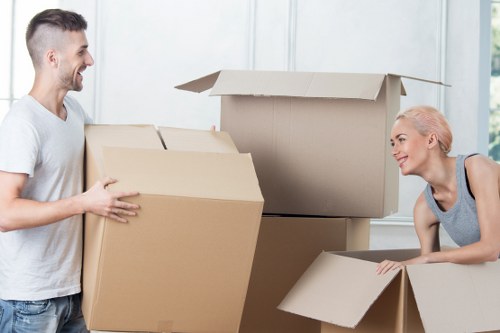 Organised storage unit in Millwall with packed boxes and furniture